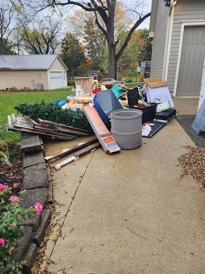 Dumpster being loaded with debris for 3 Yard Dumpster Rental in Fairbury